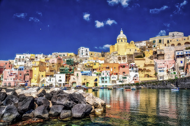 Travel to Procida Corricella bay in Procida island bay of Naples
